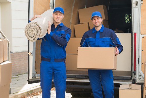 Careful handling of sofas and tables during furniture removals in Charlton