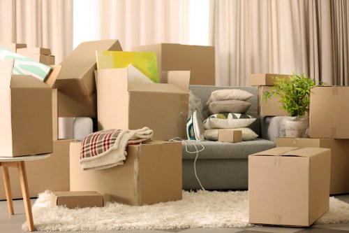Careful packing of fragile household items in Charlton
