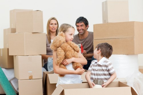 Packed moving boxes and household items ready for transport in Charlton